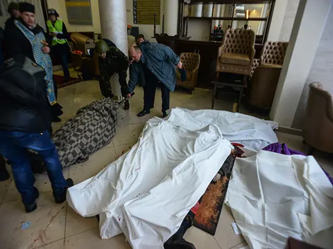 Dead bodies in a makeshift hospital and morgue in the hotel Ukraine lobby - MAKESHIFT MORGUE by R.A. Allen